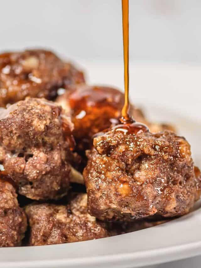 Pouring honey sriracha sauce on meatballs