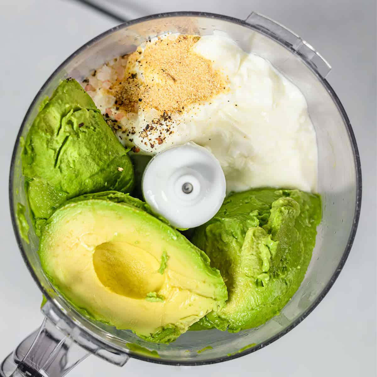 ingredients for avocado crema in the food processor