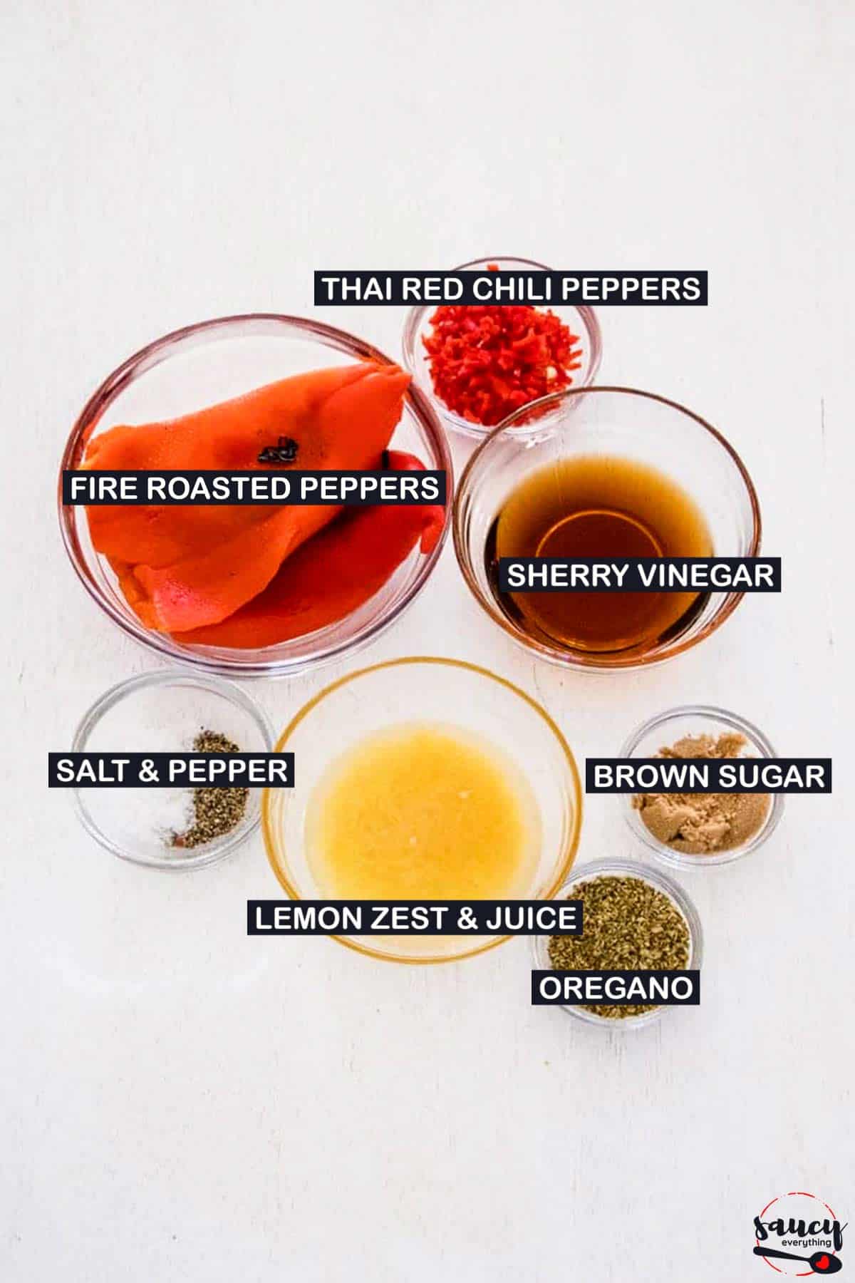 ingredients to make peri peri sauce on a white surface with labels
