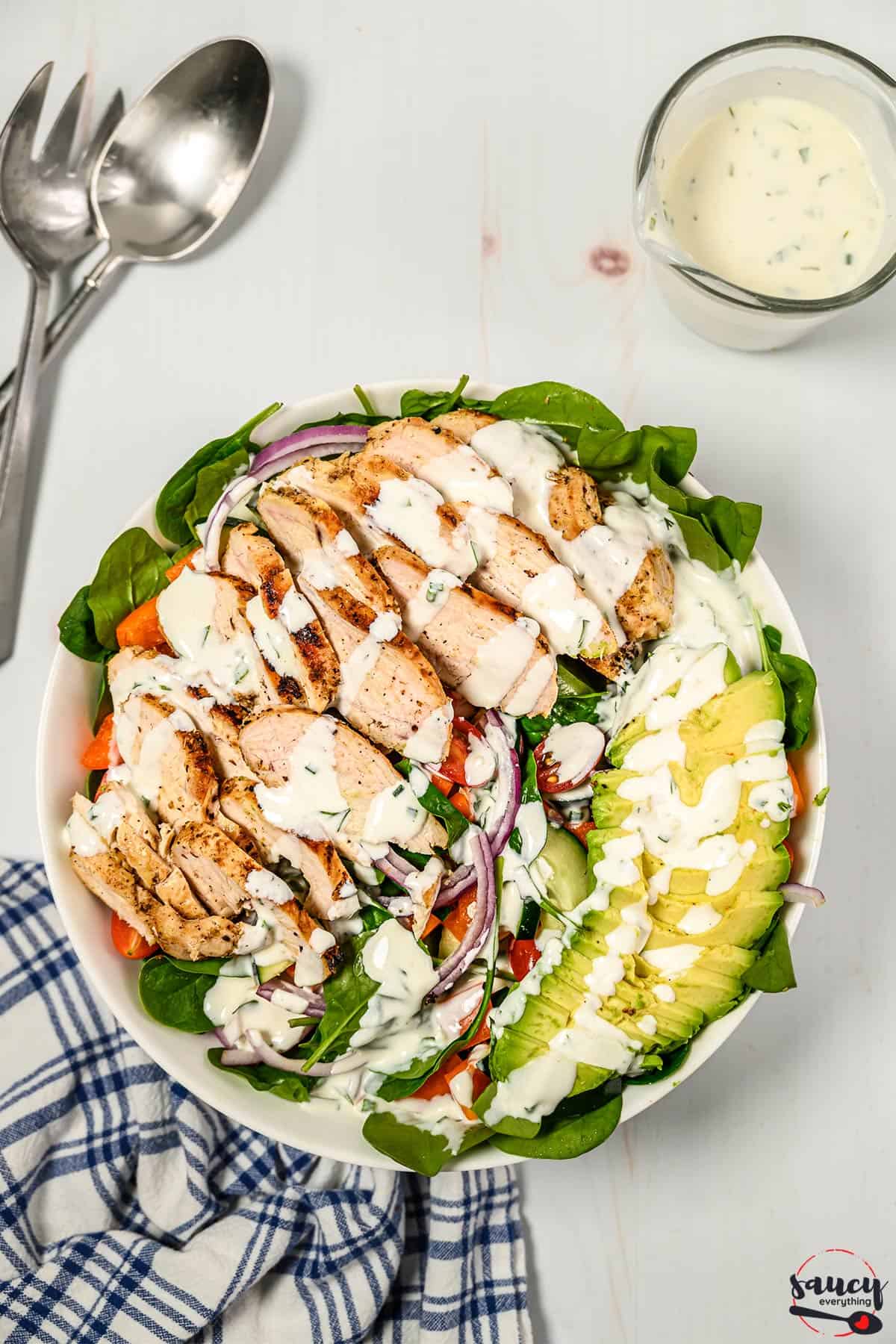 Grilled chicken salad topped with buttermilk ranch dressing
