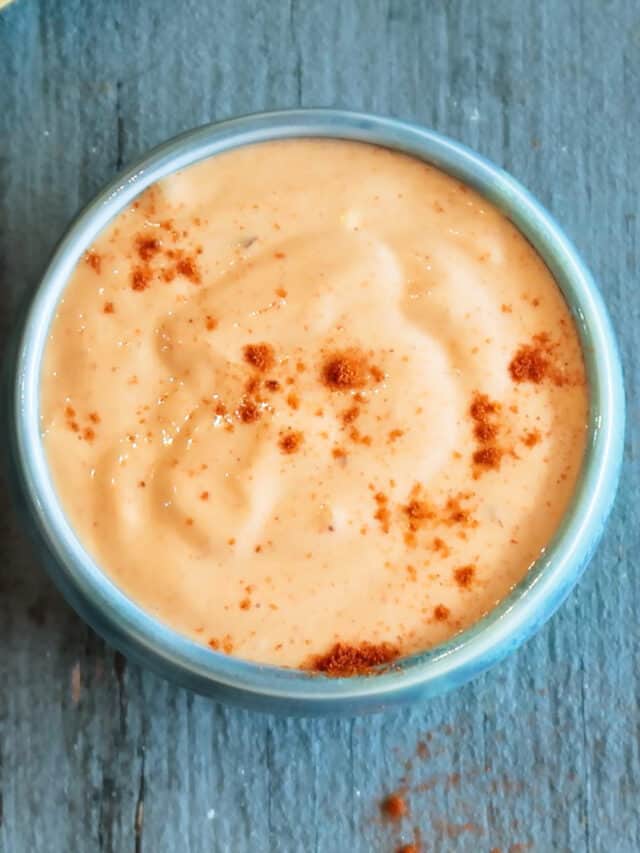 Fry sauce in a blue bowl sprinkled with red pepper