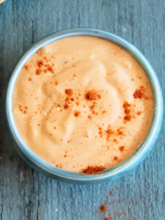 Fry sauce in a blue bowl sprinkled with red pepper