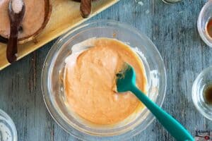 Mixing fry sauce in bowl with spatula