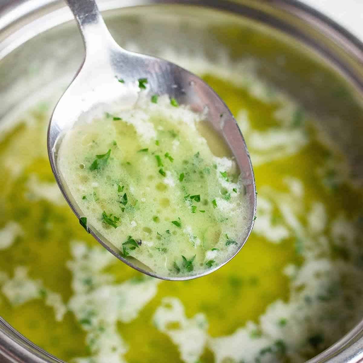 garlic butter sauce on a spoon