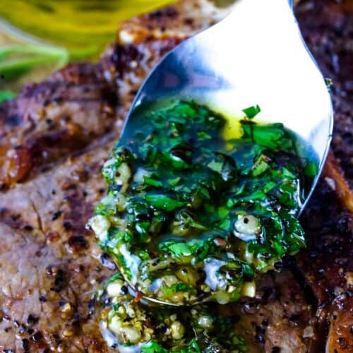 Chimichurri sauce on a spoon close up