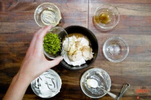 Adding all horseradish sauce ingredients to a bowl