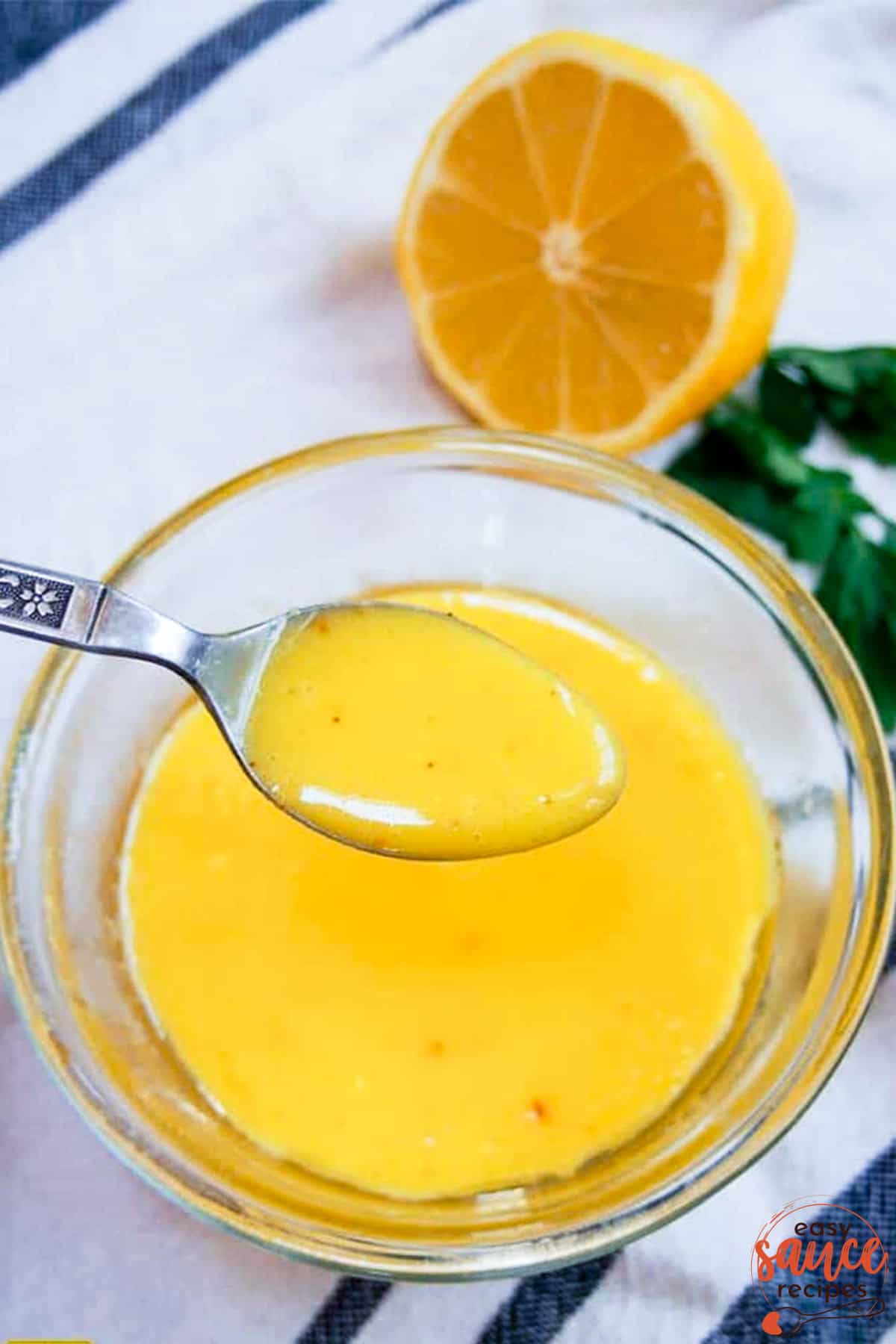 hollandaise sauce in a bowl with a spoon