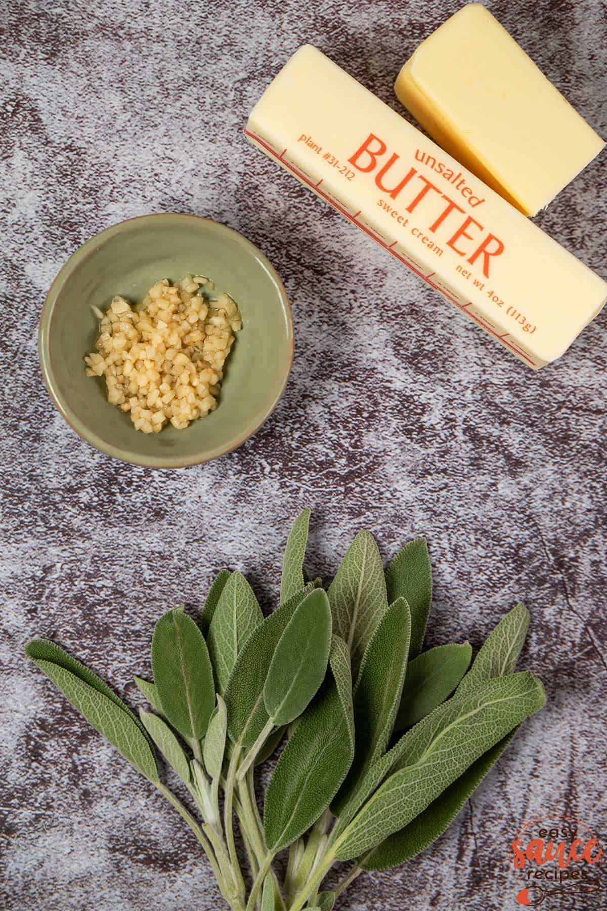 Ingredients for sage brown butter sauce on a surface