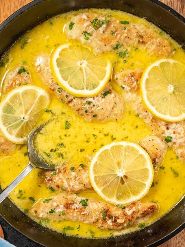 skillet with garlic lemon butter sauce and a spoon