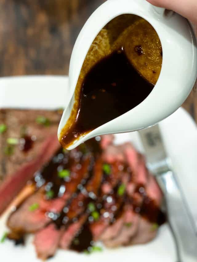 Pouring sauce over london broil