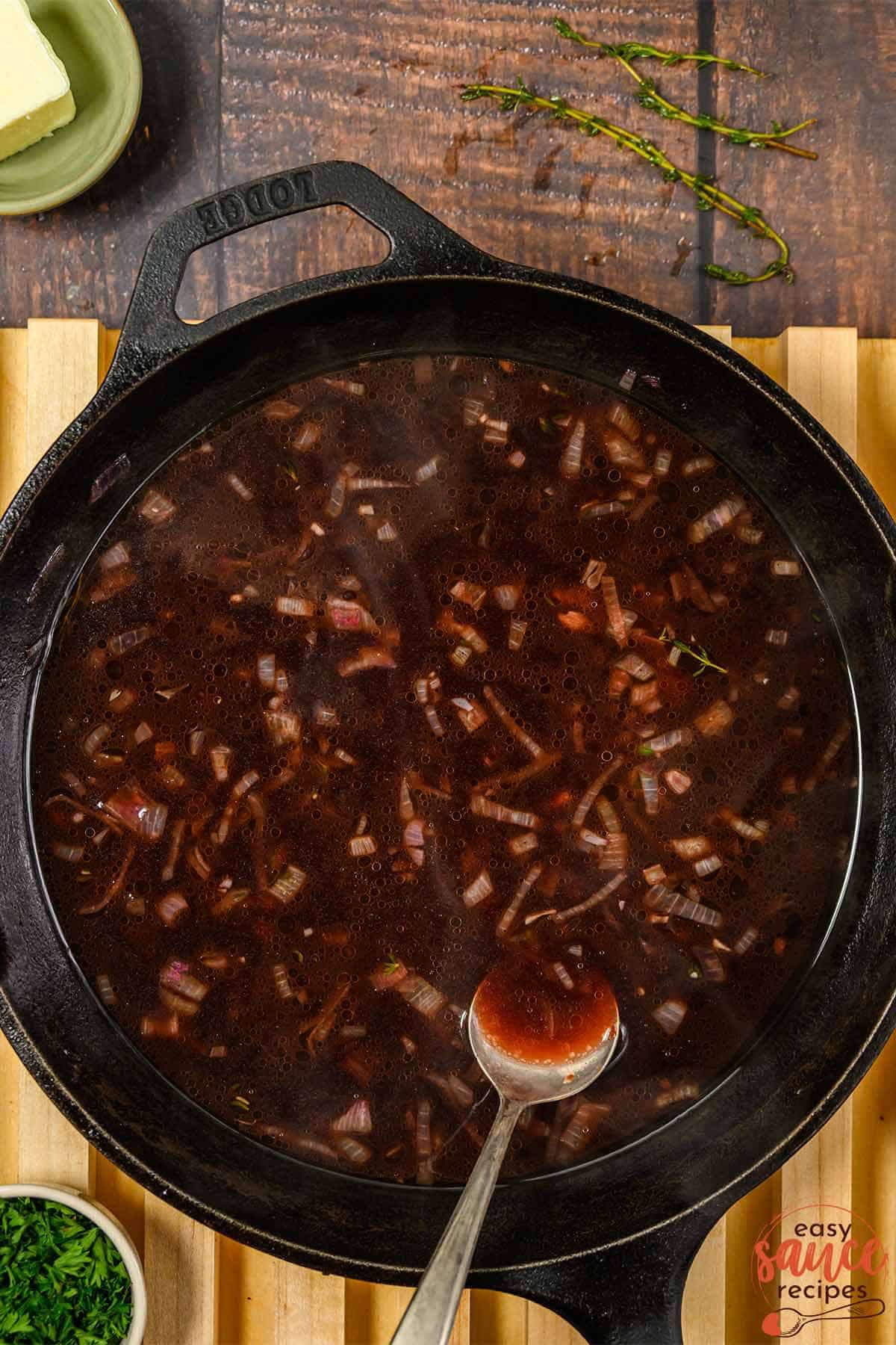 thickened red wine sauce in pan