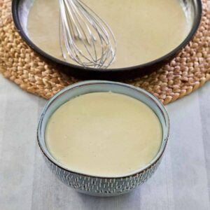 bechamel sauce in bowl and pan