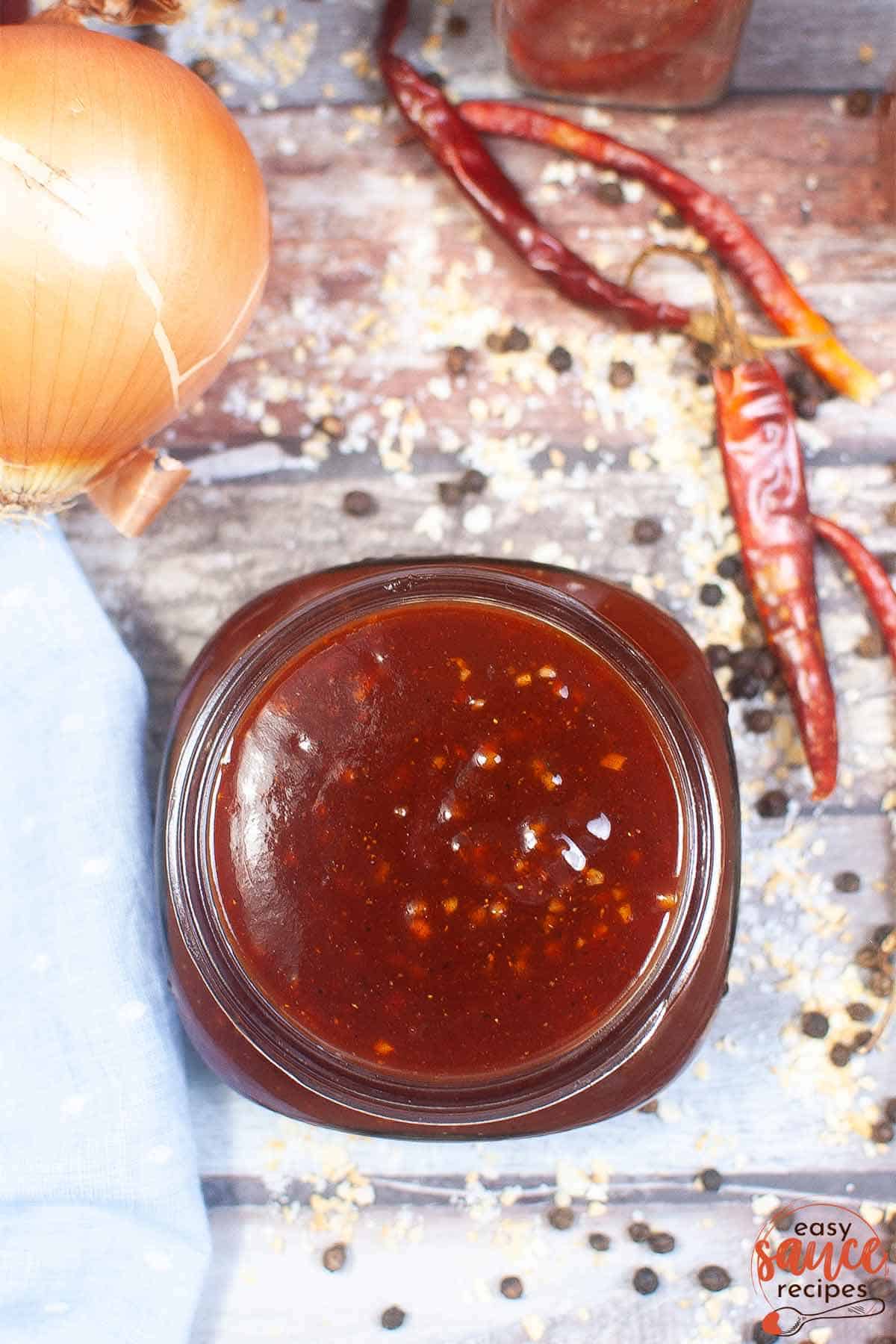 cooked bbq sauce in a mason jar top-down view
