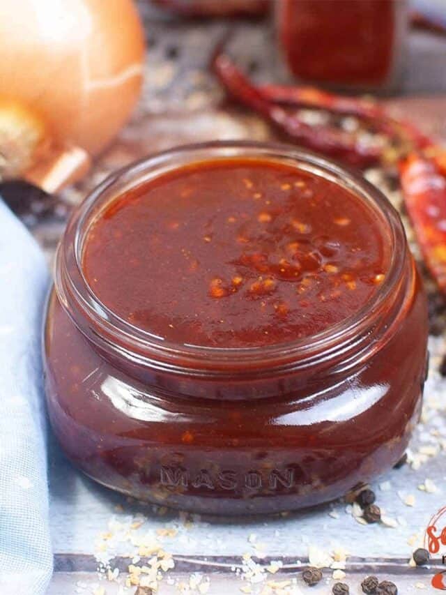 bbq sauce in a jar with a spoon
