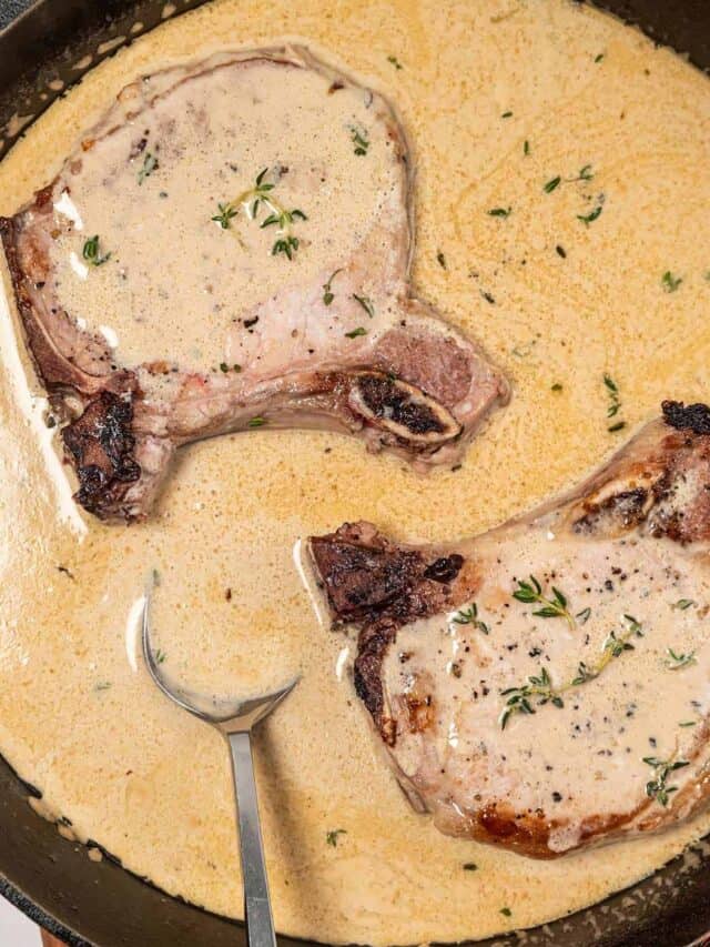 dijon mustard sauce in a cast iron pan with pork chops