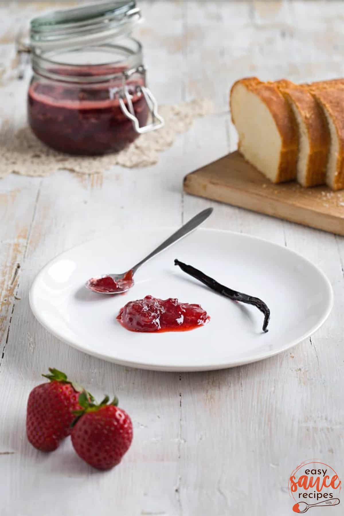 strawberry jam on a plate with a vanilla bean