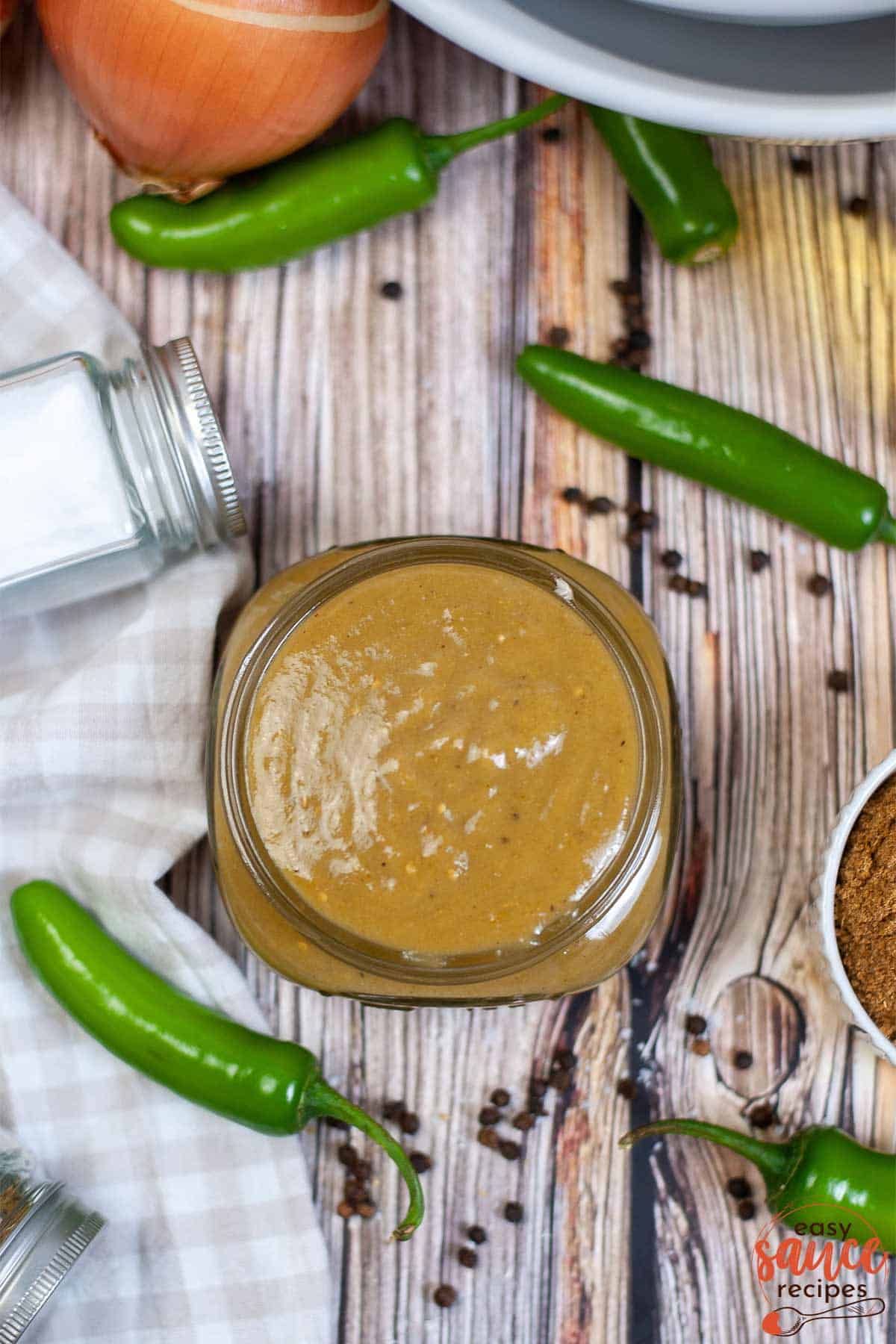 green enchilada sauce in a jar overhead shot