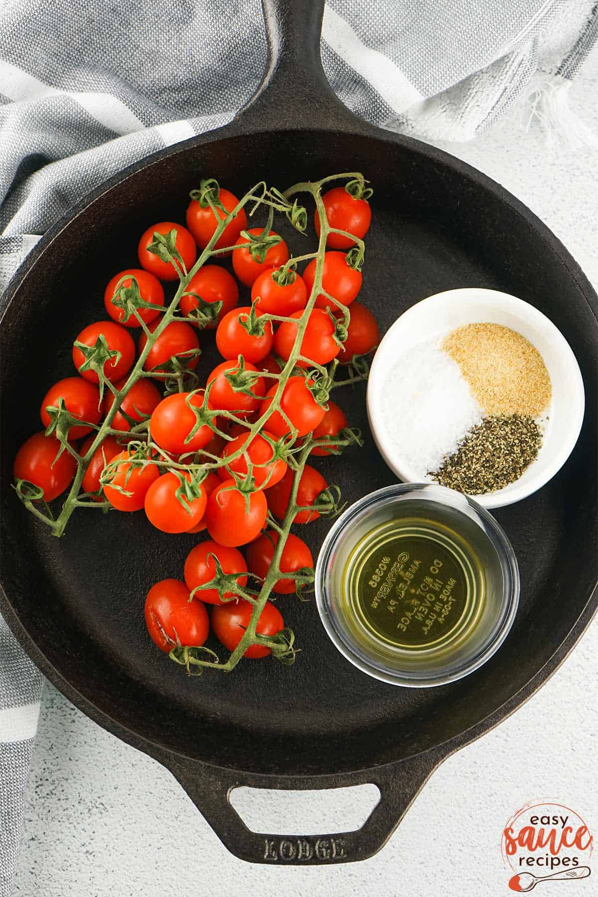 ingredients for roasted tomatoes in a skillet