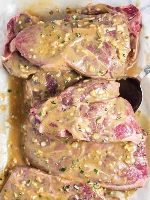 raw lamb chops coated in marinade