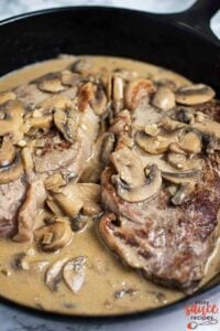 Diane sauce with steak in a skillet