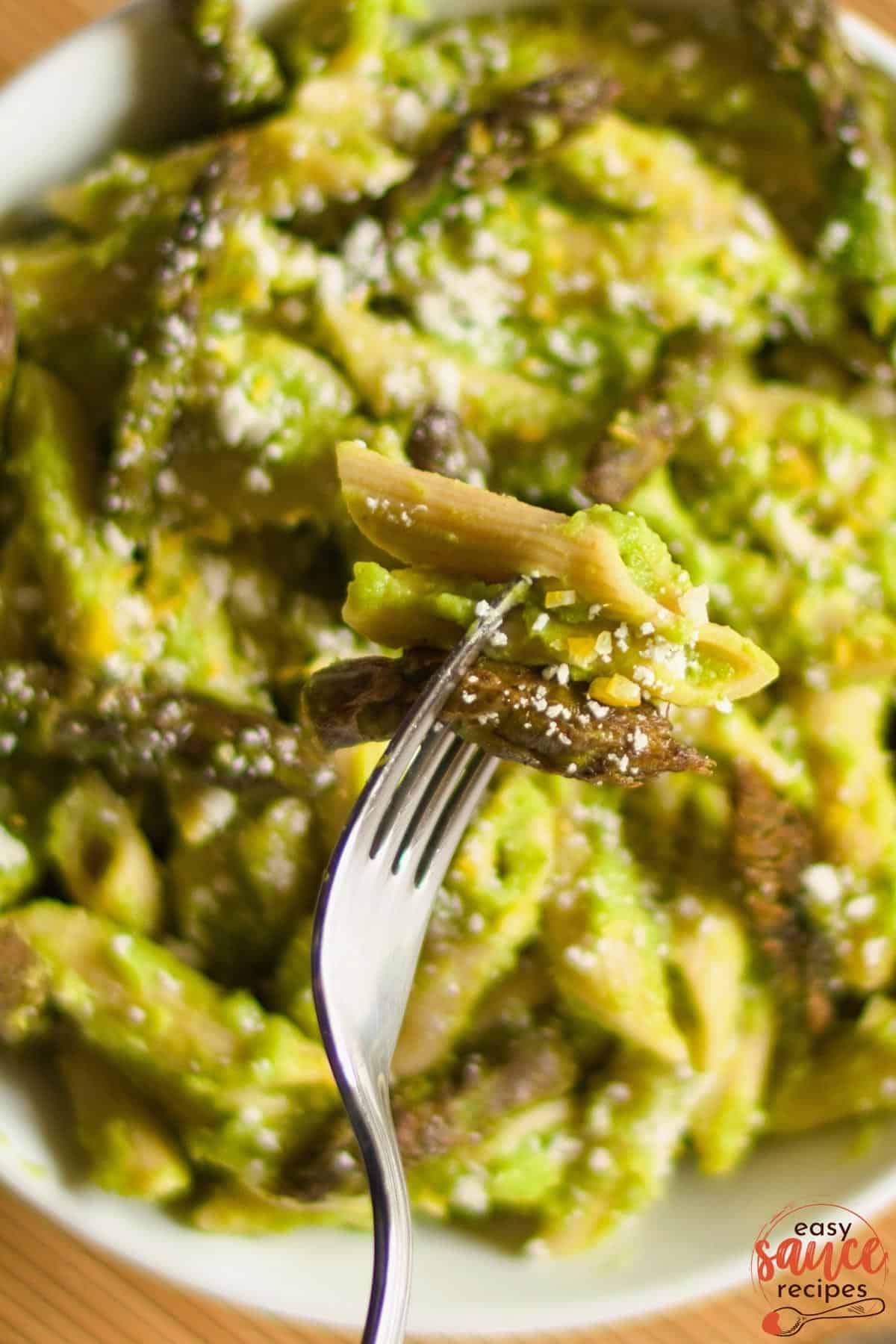 pea sauce tossed with noddles on a fork