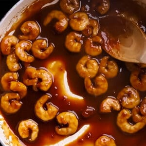 top view of a pan with sweet chili sauce and prawns