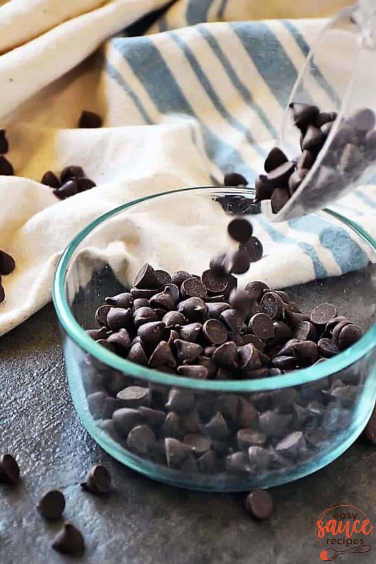 adding chocolate chips to a bowl
