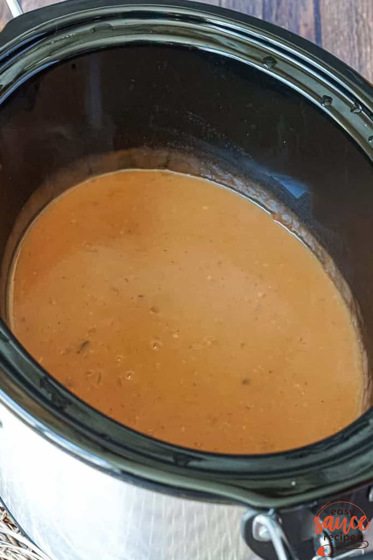 pot roast gravy cooking in a crock pot
