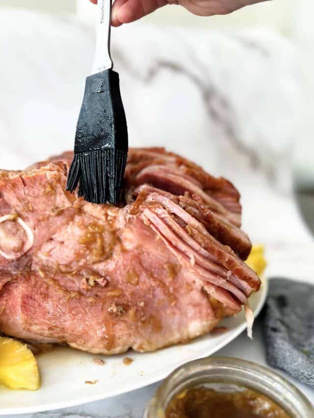 brushing ham with pineapple sauce for ham