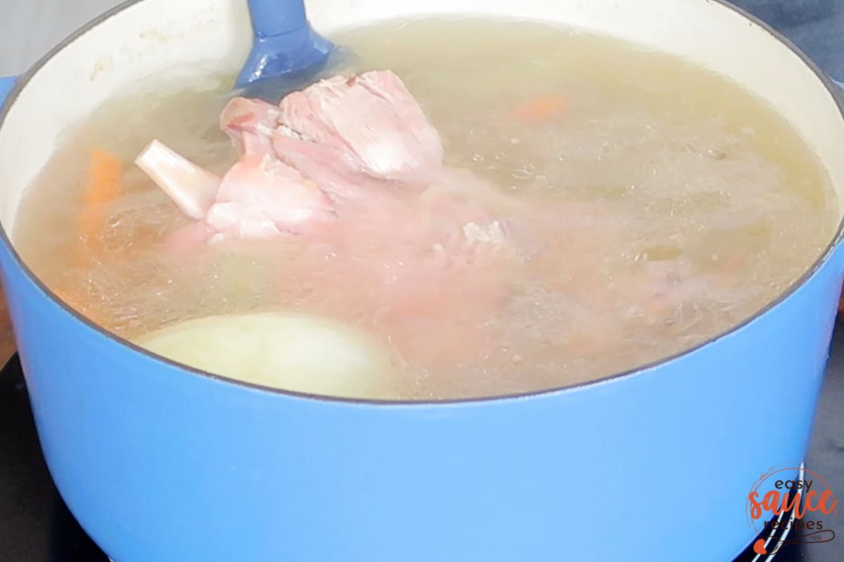 stirring ham bone broth after simmering