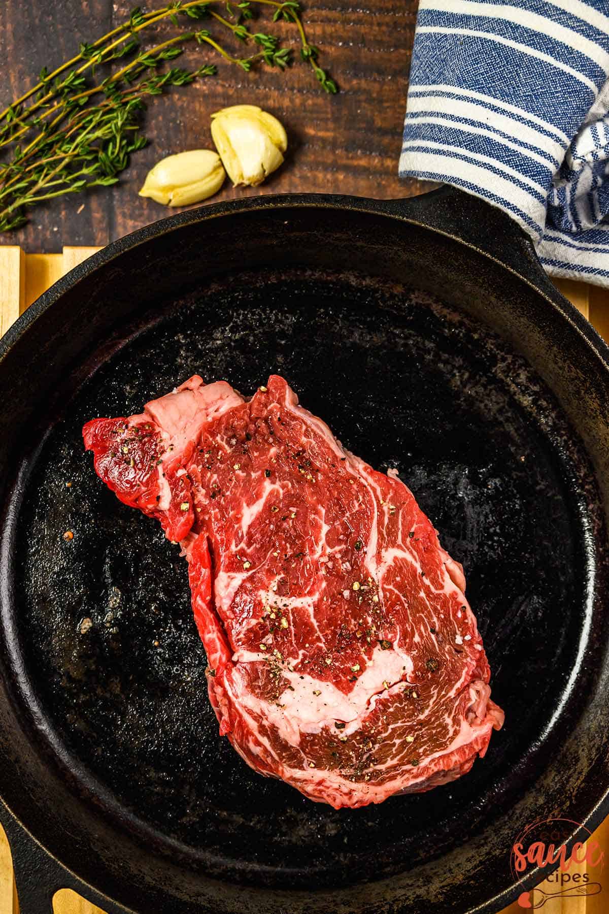 a steak added to a pan to sear
