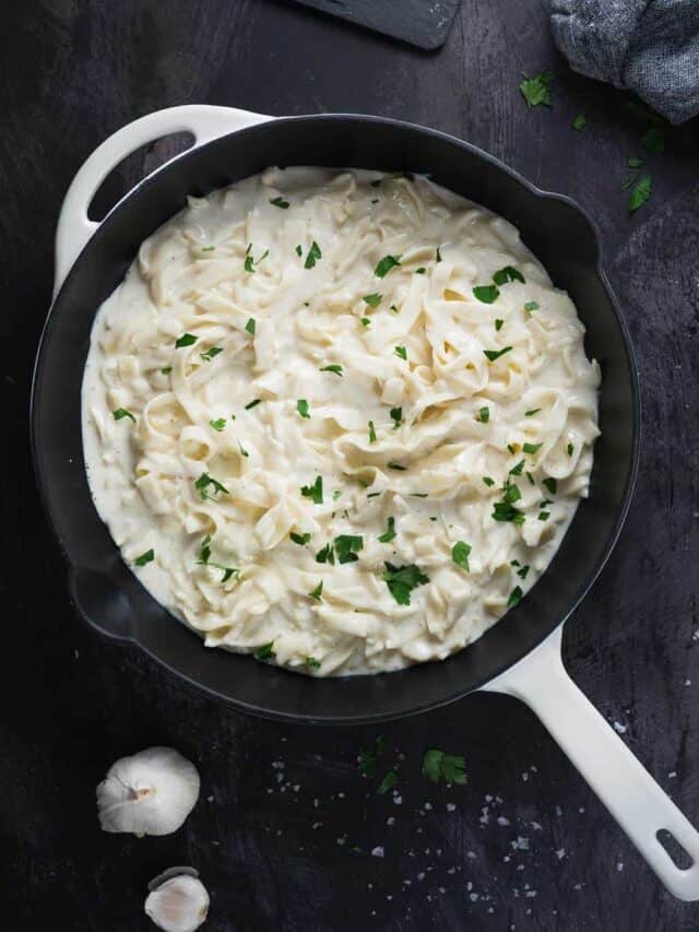 Alfredo ready to be served in a skillet