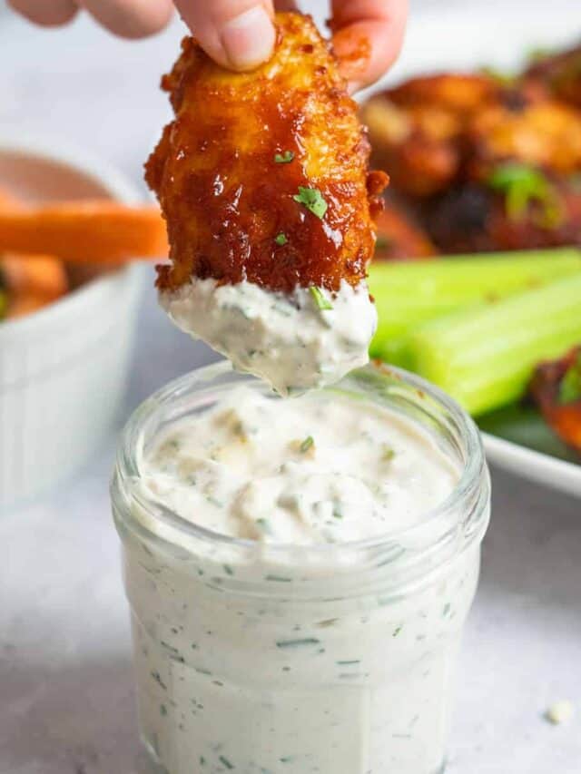blue cheese with a wing dipping inside
