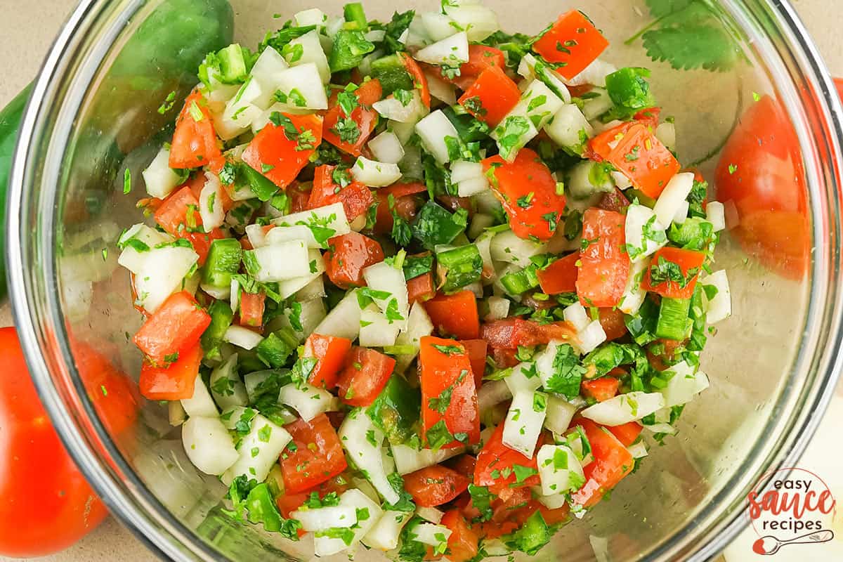 pico de gallo all mixed up in a clear bowl