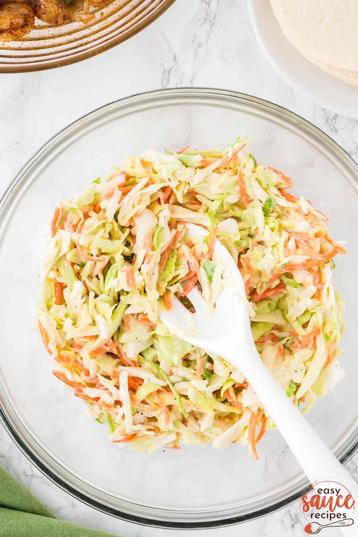 mixed coleslaw in a mixing bowl