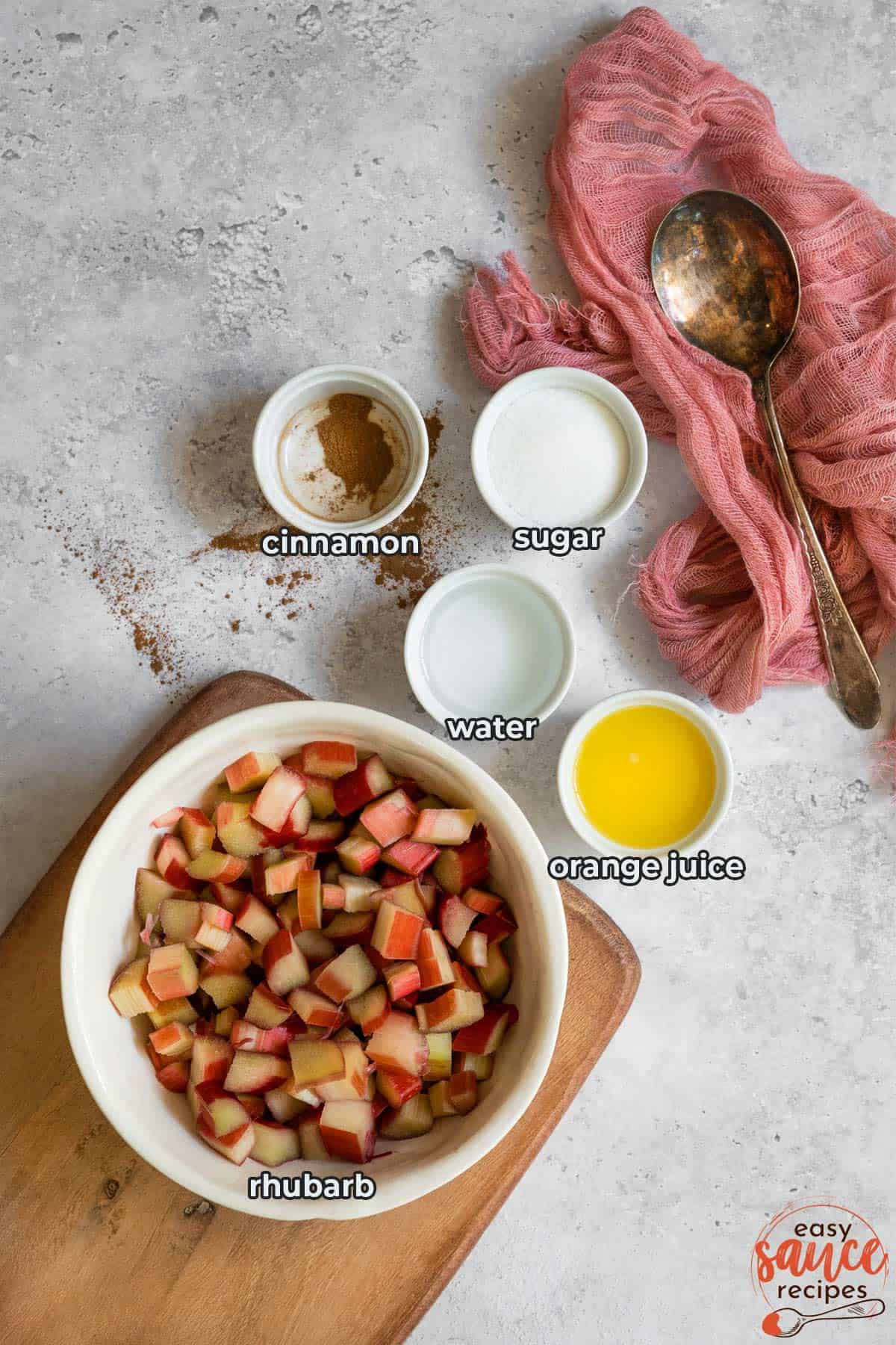 all the ingredients for stewed rhubarb in separate bowls with labels