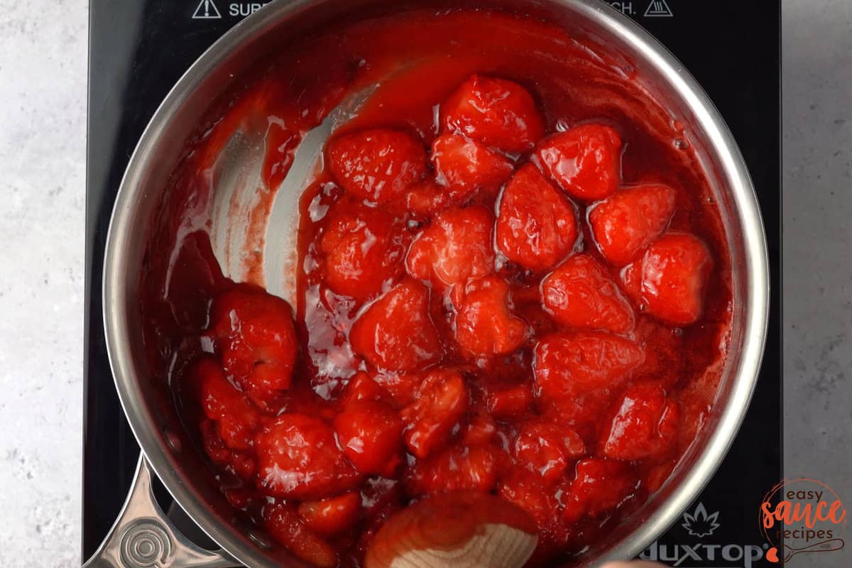 simmering strawberries in a saucepan