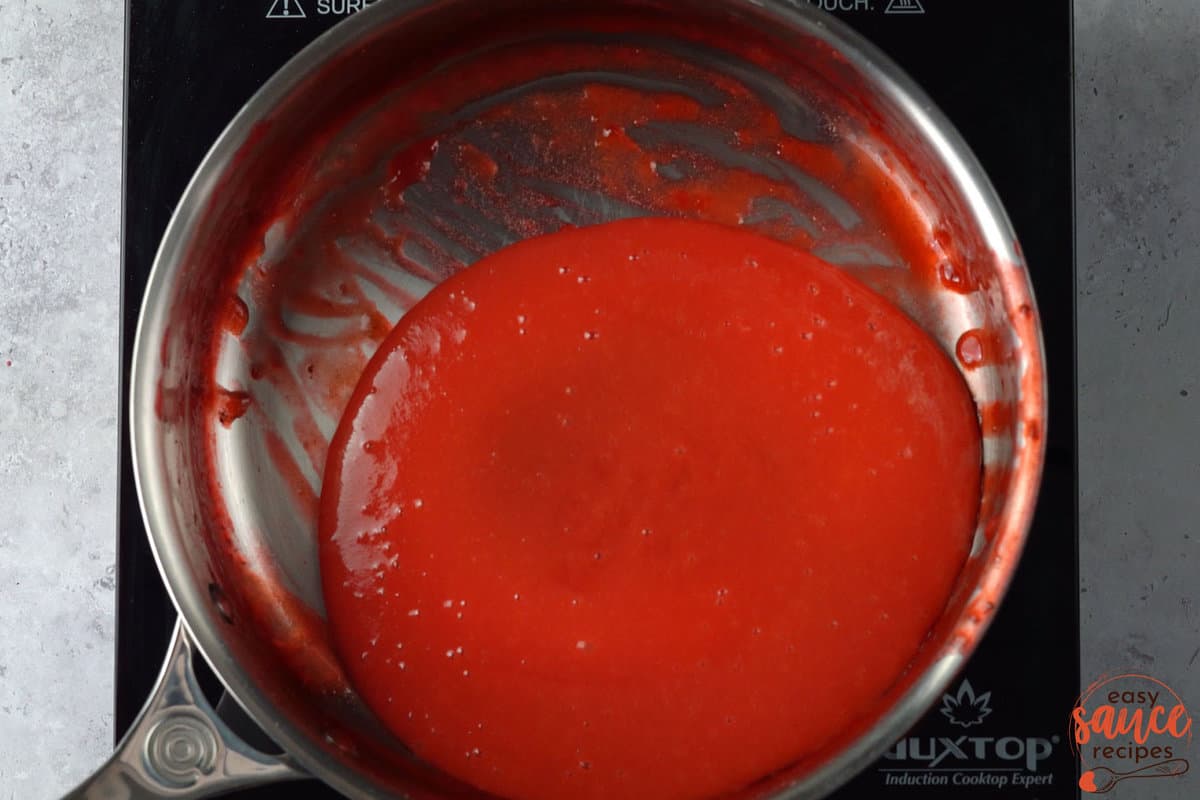 blended strawberry sauce in a saucepan