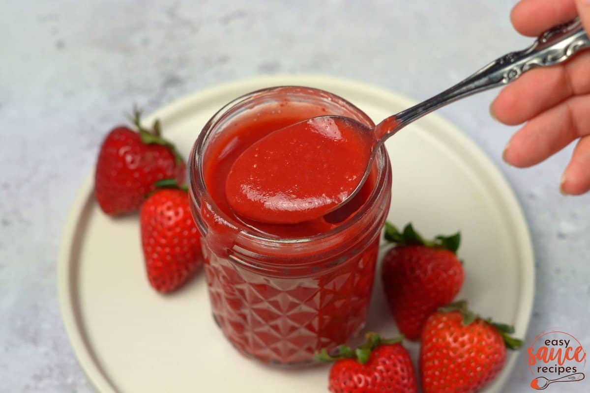 strawberry sauce in a clear mason jar
