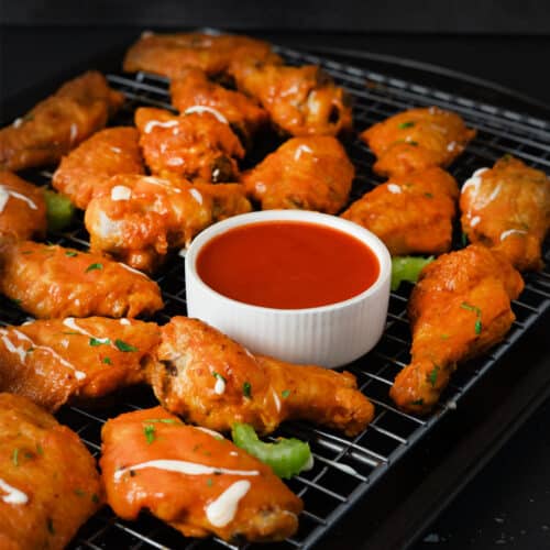 buffalo chicken wings with buffalo sauce in the middle