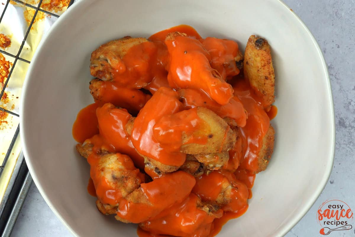 buffalo sauce over top of chicken wings