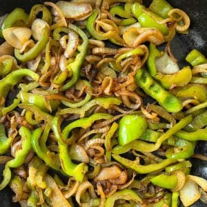 peppers and onions sauteed to golden in a pan