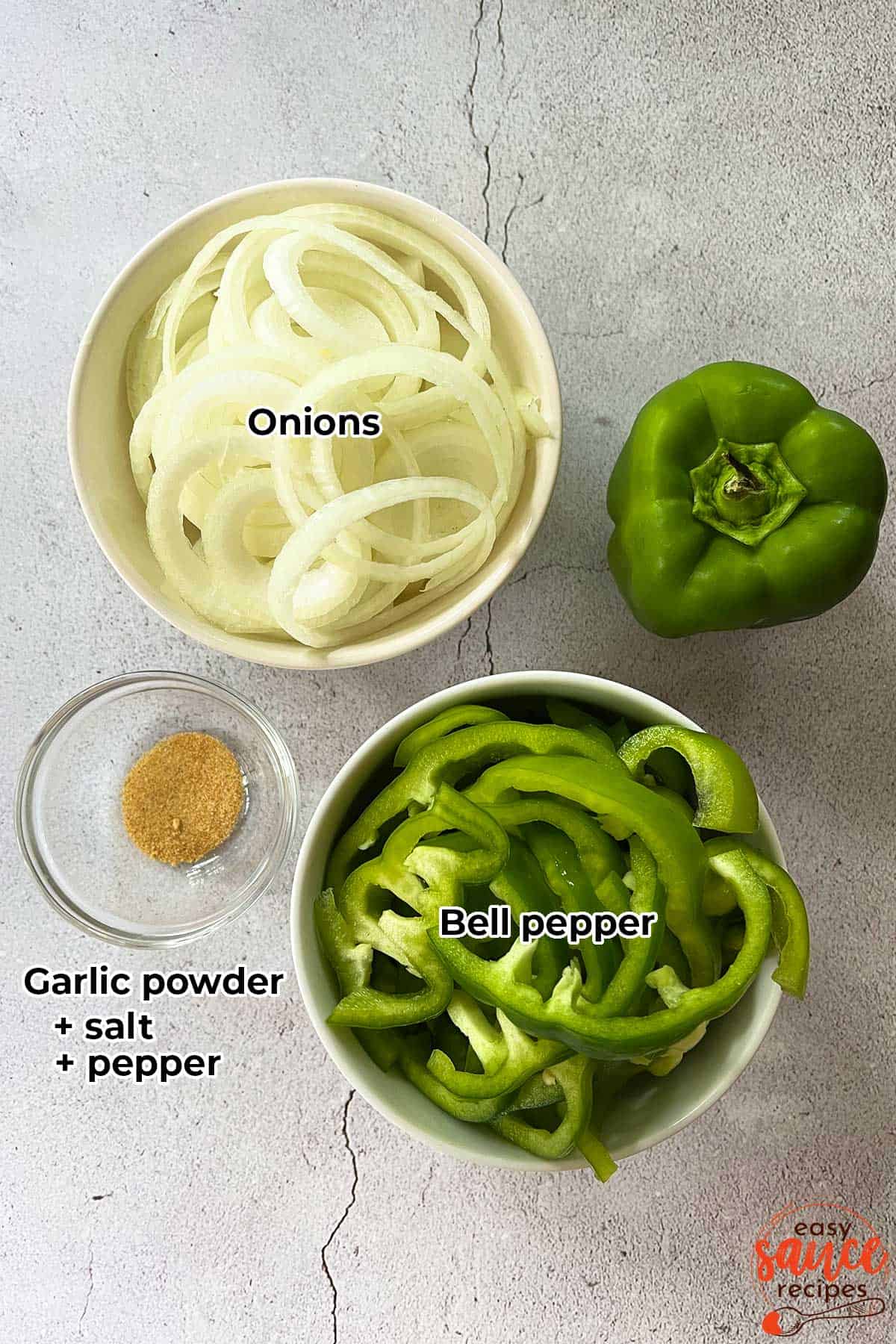 the ingredients for sauteed peppers and onions in separate bowls with labels