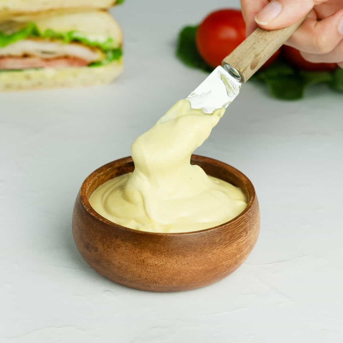 mayo mustard sauce in a small wooden bowl